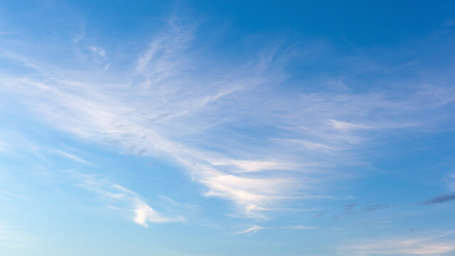 Blue clear sky with white fluffy clouds