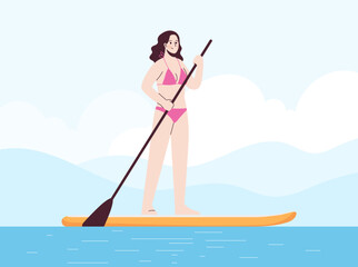 Young woman is standing in swimsuit on sup . Stand up paddle.