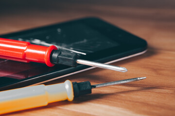 screwdrivers on the broken tablet