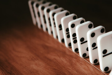 White dominoes in the dark close up