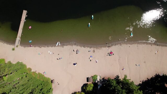 Drone Top View of People Enjoying Summer at a Beach Park