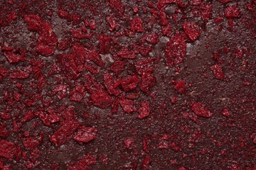 Chocolate bar with freeze dried fruits as background, closeup