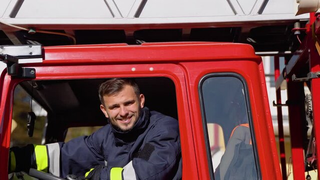 Portrait of driver of a fire truck. Concept of saving lives, fire safety
