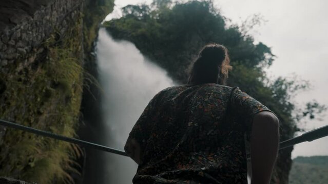 Traveler On The Viewpoint Of Pailon del Diablo Waterfall In Rio Verde, Ecuador. Handheld