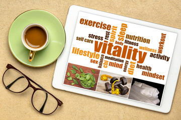 vitality or vital energy concept on a  digital tablet, a collage of pictures and a word cloud, flat...