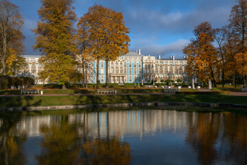 Fototapeta na wymiar View of the Catherine Palace with reflection in the Mirror Pond of the Catherine Park in Tsarskoye Selo in the sunny autumn day, Pushkin, St. Petersburg, Russia