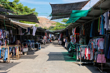 A popular large secondhand clothes market with sunshades and hundreds of vendor stalls, for locals and tourist, in capital Dili, Timor Leste, Southeast Asia