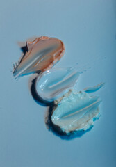 cream smears on a light background, skin care concept