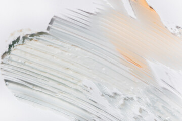 Cosmetic smears and drops. Appearance of the texture of the cream, oil and granules on a white background. Natural skincare products. Beauty concept for face and body care