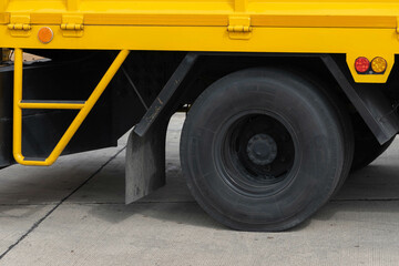 Tire a big yellow truck.