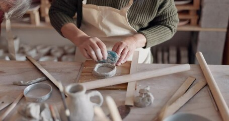 Pottery, woman and make clay mold in creative class shape, smooth and with artistic tools in studio and workplace. Student works with ceramic cups for art, hobby and sculpting workspace and gallery,