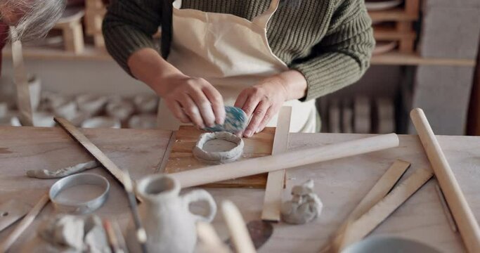 Pottery, woman and make clay mold in creative class shape, smooth and with artistic tools in studio and workplace. Student works with ceramic cups for art, hobby and sculpting workspace and gallery,