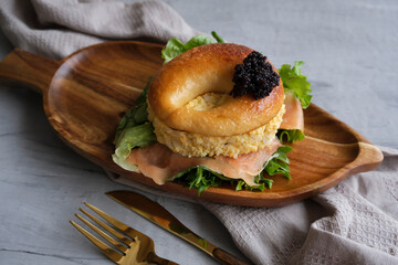 Delicious homemade pastry. Smoked Salmon Egg Mayo Bagel Sandwich with Black Caviar and Mesciun Salad. Great for brunch or lunch meal