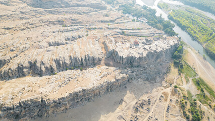 Archaeological site with the remains of a rock-cut settlement dating back to the Iron Age.