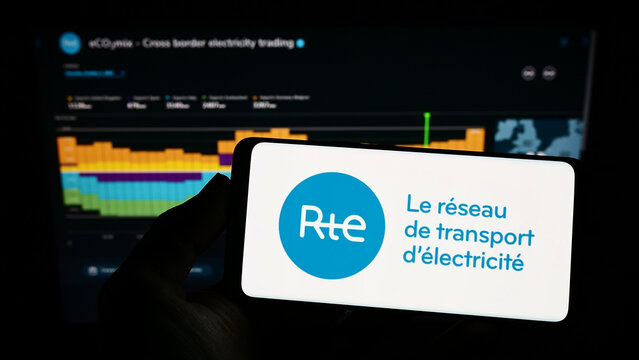 Stuttgart, Germany - 10-01-2022: Person holding smartphone with logo of Reseau de Transport d'Electricite S.A. (RTE) on screen in front of website. Focus on phone display.