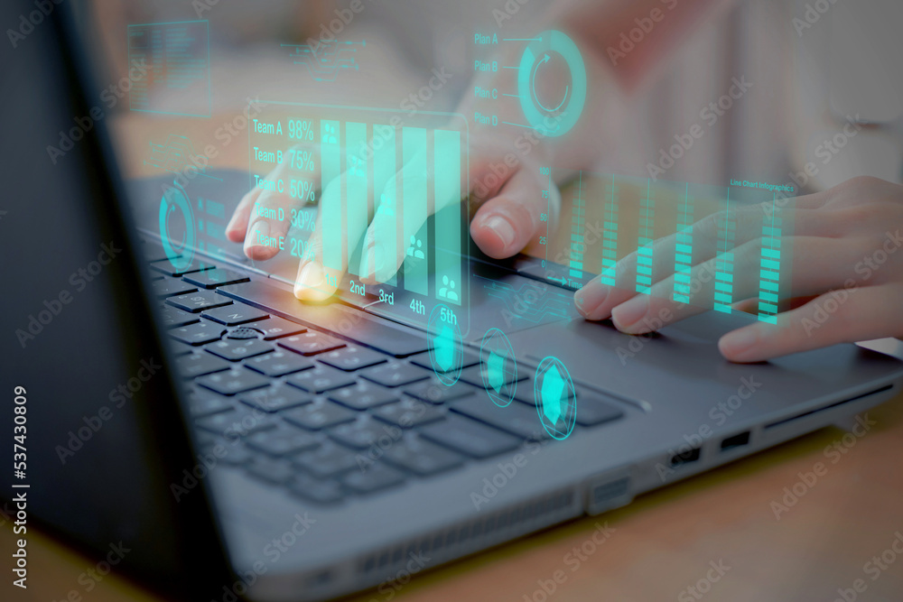 Poster woman using laptop analyzing development at various information on futuristic virtual interface scre