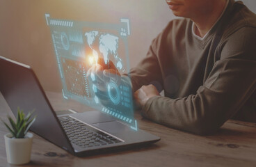 A Businessman use laptop for analyze and management data to succeed on virtual screen.