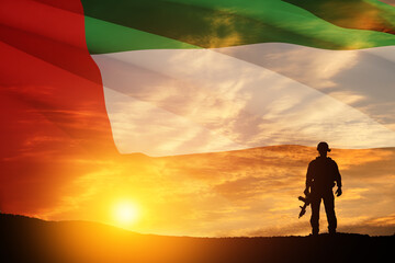 Silhouette of soldier on background of UAE flag and the sunset or the sunrise. Concept of national holidays. Commemoration Day.