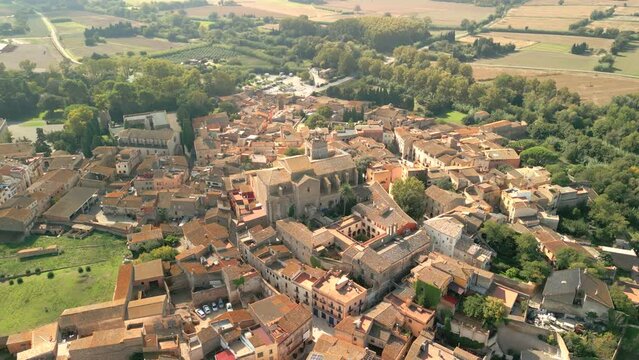 Aerial image of the city of Peralada in Girona Costa Brava small medieval town  Circular flight with the Cathedral Church in the center