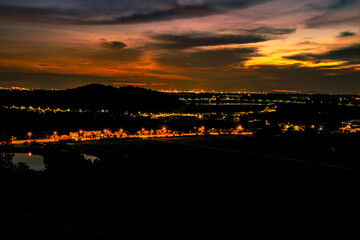 High angle nature background on the mountain overlooking the evening sky changing colors at night, with the blur of the wind and the passing leaves, seen at various tourist spots and viewpoints.
