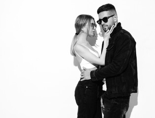 Sexy smiling beautiful woman and her handsome boyfriend. Happy cheerful family having tender moments.Young passionate couple hugging. Sensual pair isolated on white. Cheerful and happy