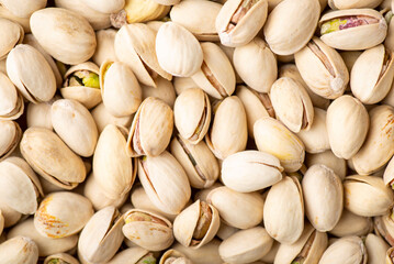 Pistachio background. Many taste pistachios with salt ready to be eaten