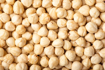 Close up photo of many peeled hazelnuts. Background of hazelnuts, tasty roasted nuts to add to dishes