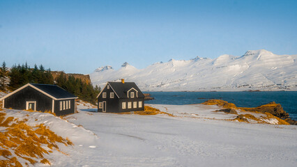 Teigarhorn Natural Monument and Nature Preserve farm with sea and snow mountain at Djúpivogur ,...