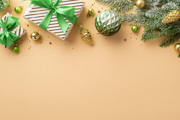 Christmas concept. Top view photo of stylish gift boxes with ribbon bows gold and green baubles balls pine cone ornaments confetti and fir branch in frost on isolated beige background with empty space