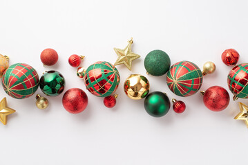 Christmas decorations concept. Top view photo of red green gold baubles balls and star ornaments on...
