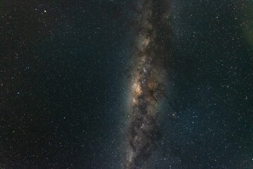 A night time photo of the Milky Way galactic core and detailed surrounding nebula against a dark starry sky in the southern hemisphere of Australia.