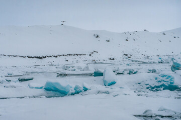 Jokulsarlon  , glacial lagoon bordering Vatnaj&ouml;kull National Park during winter snowy day near Vik , Seafront village in South Coast of Iceland : 20 March 2020