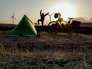 Gordijnen adventurer traveling camping by bike © emerald_media