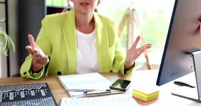 Woman working in office is clueless and confused with open arms without clue or doubt