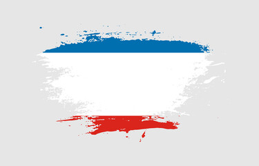 Grunge brush stroke with the national flag of Crimea on a white isolated background