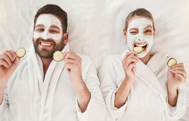 Couple, facial and relax at spa for wellness, skincare and love together with cucumber. Happy portrait luxury body care or face detox mask in physical therapy for calm and zen beauty or health salon