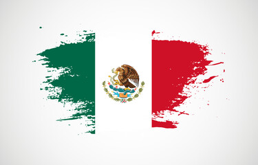 Grunge brush stroke with the national flag of Mexico on a white isolated background