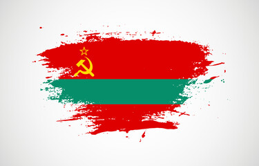 Grunge brush stroke with the national flag of Transnistria on a white isolated background