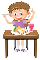 Happy boy enjoy eating food on table