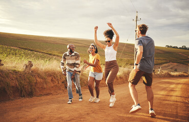 Friends, nature and dance with a man and woman group outdoor in a desert on a sand road with...