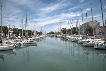 Fototapeta na wymiar Boats moored along Rimini canal port