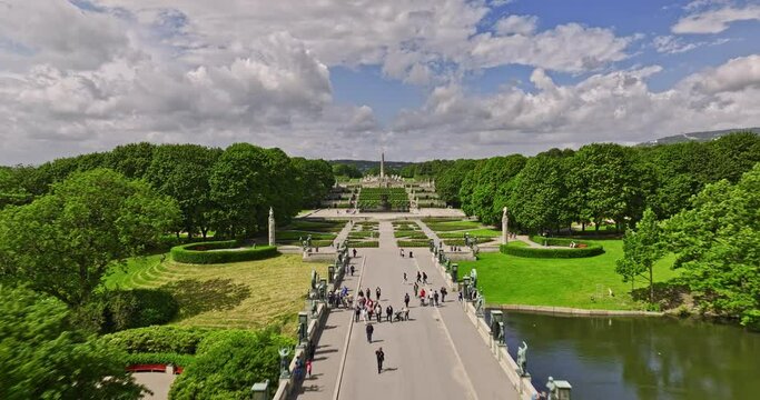 Oslo Norway v47 low level drone flying straight above frogner park capturing artistic sculptures, flyover reveals montebello residential neighborhood in summer - Shot with Mavic 3 Cine - June 2022