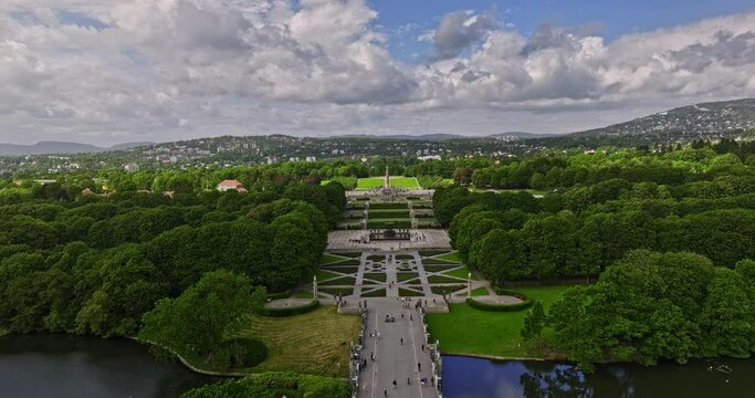 Oslo Norway v43 establishing low level drone flyover frogner park along the pathway with smestad and montebello neighborhoods landscape view on a sunny day - Shot with Mavic 3 Cine - June 2022