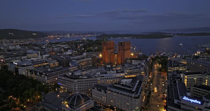 Oslo Norway v55 cinematic low level drone flyover rådhuset city town hall, capturing illuminated downtown night cityscape and waterfront harbor view - Shot with Mavic 3 Cine - June 2022