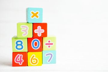 Number wood block cubes for learning Mathematic, education math concept.