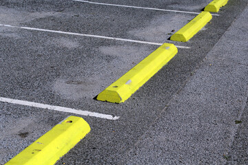 Yellow parking blocks in a carpark