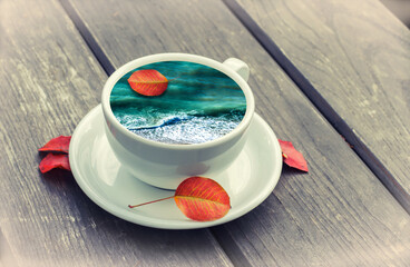 Cup with coffee on a wooden background.