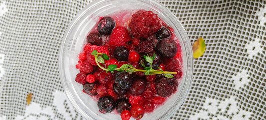 Top view of refreshing cold mixed berry soda in a glass. space for banner text