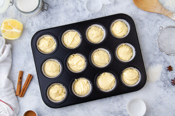 Muffin molds filled with raw dough. Part 5/9