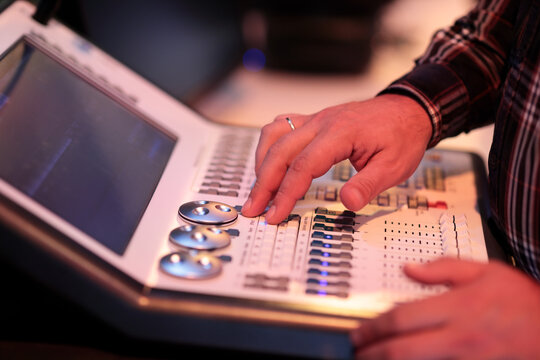 operator controls stage light with compact console